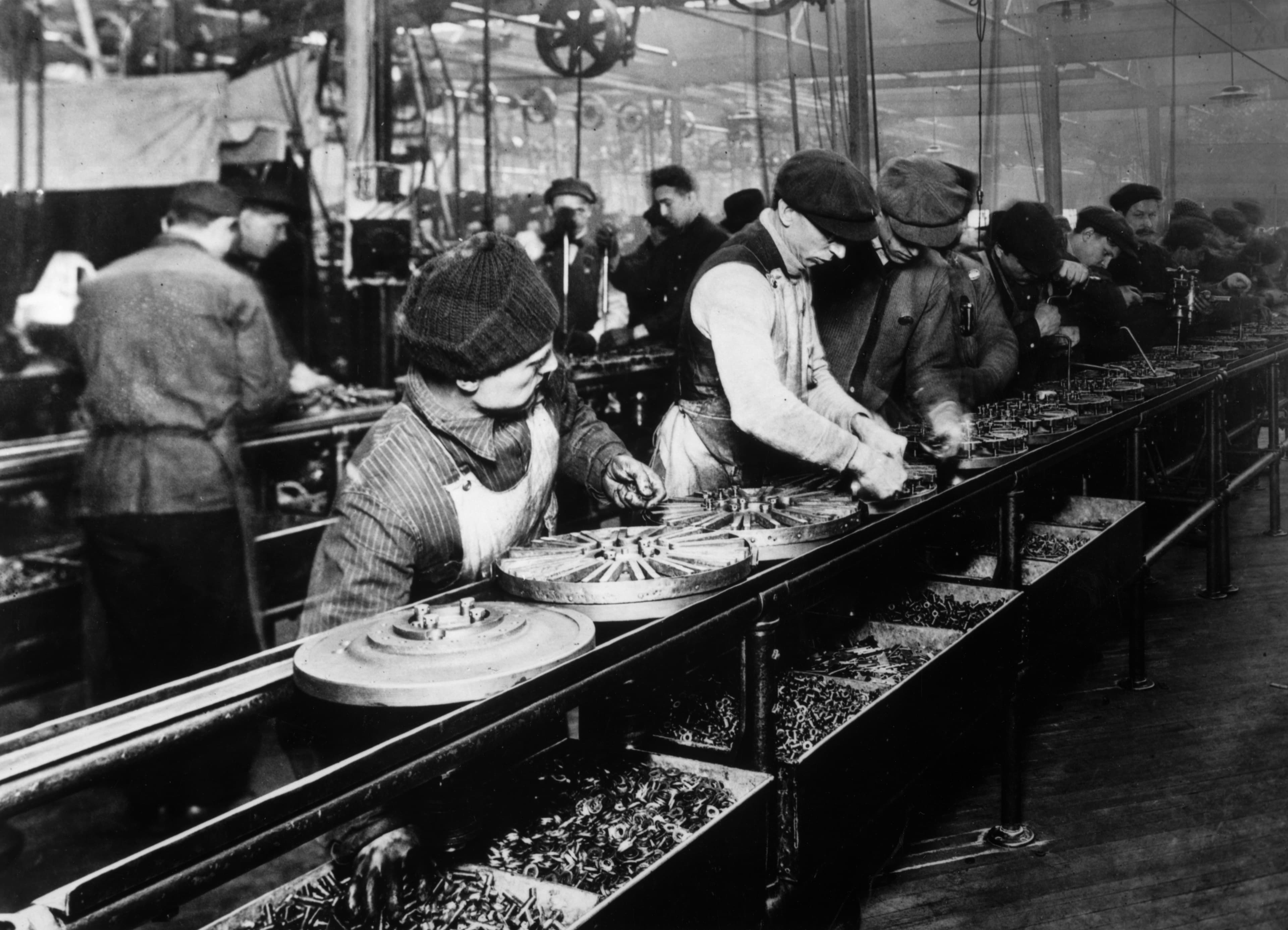 Workers on the Ford Motor Company moving assembly line, 1913